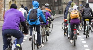 A large group of bicyclist on the street. They would benefit greatly from Glympse Premium Tags.