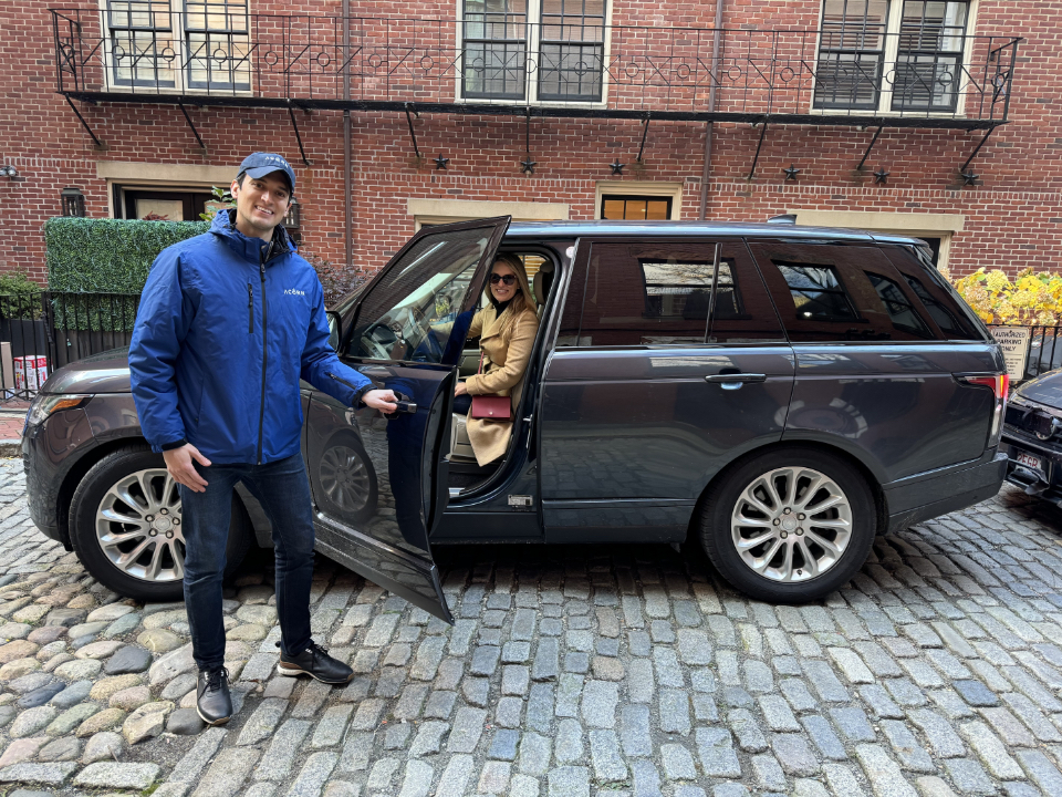 Acorn Valet driver opening door for passenger